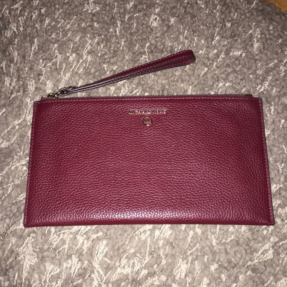 Michael Kors Nwot dark wine colored wristlet